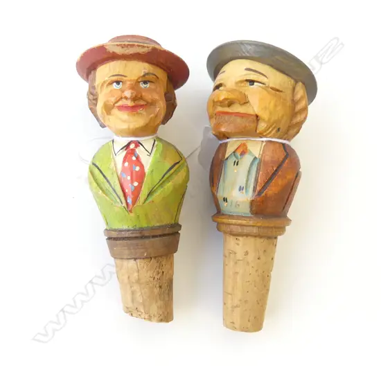 TWO CARVED BLACK FOREST GERMAN BOTTLESTOPS, ONE ARTICULATED AS  OLD MAN MOVING JAW