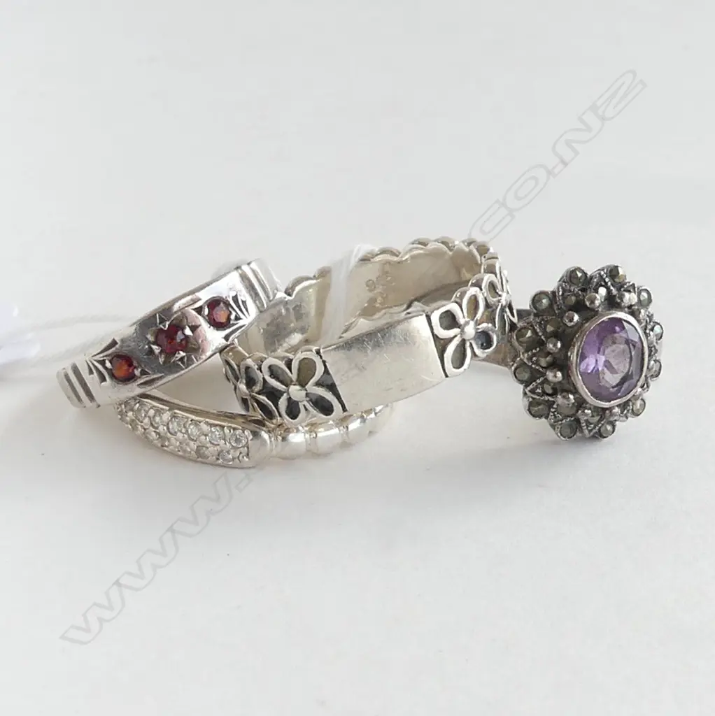 FOUR SILVER RINGS (ONE WITH AMETHYST/ONE WITH GARNETS) Image 1++