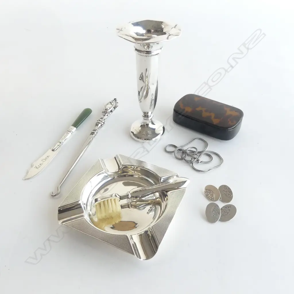 7 PCES STG SILVER; VASE, ASHTRAY, PR CUFFLINKS, MOUSTACHEBRUSH, KNIFE, BOOT HOOK, NECKLACE + TORTOISESHELL BOX W.80mm AF Image 1++