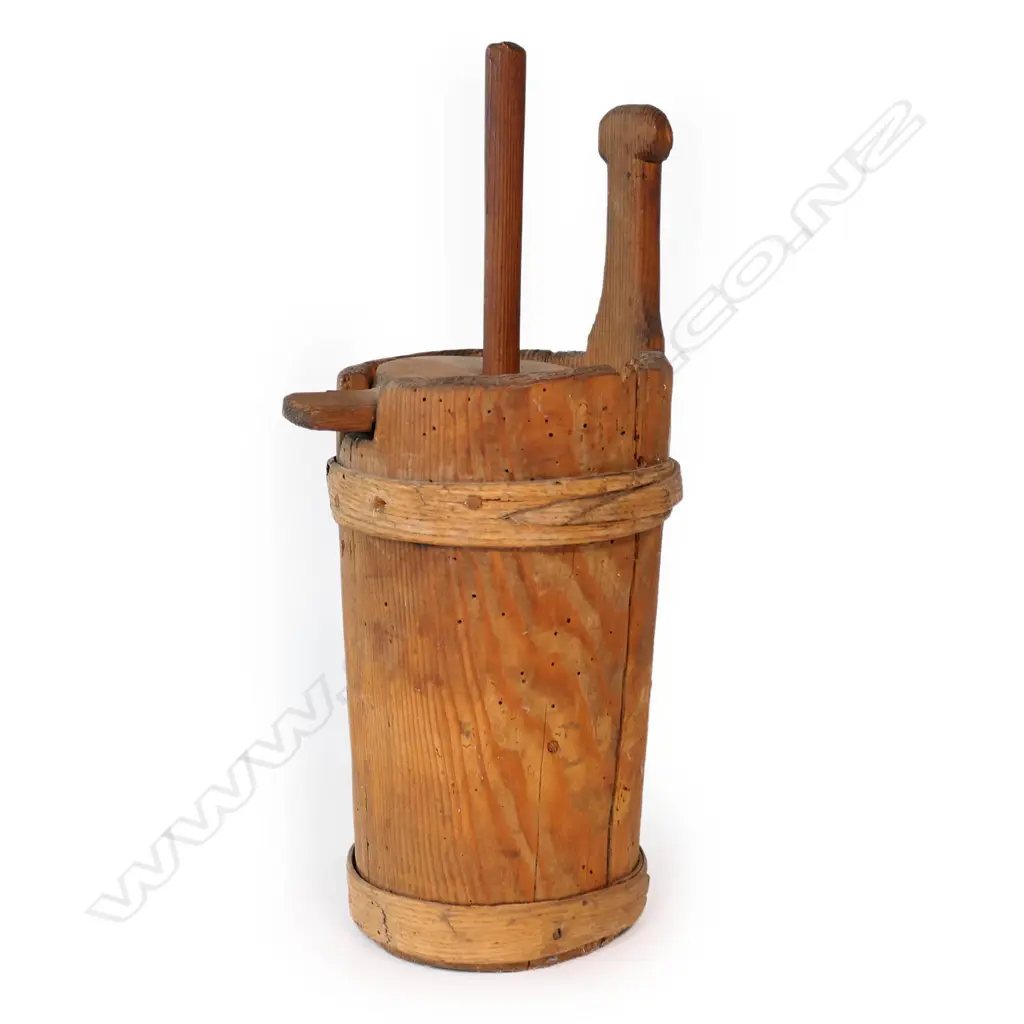 A 19thC Austrian/German turned and carved wood small butter churn mildly tapered cylindrical form the fitted lid supporting the plunger. Pinned bound strapping. H.350mm. Image 1++