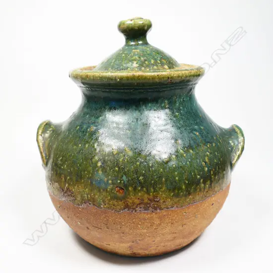 Andrew Van der Putten lidded storage vessel green glaze to the lid and top half of the body. pair of lug handles. Lid repaired,