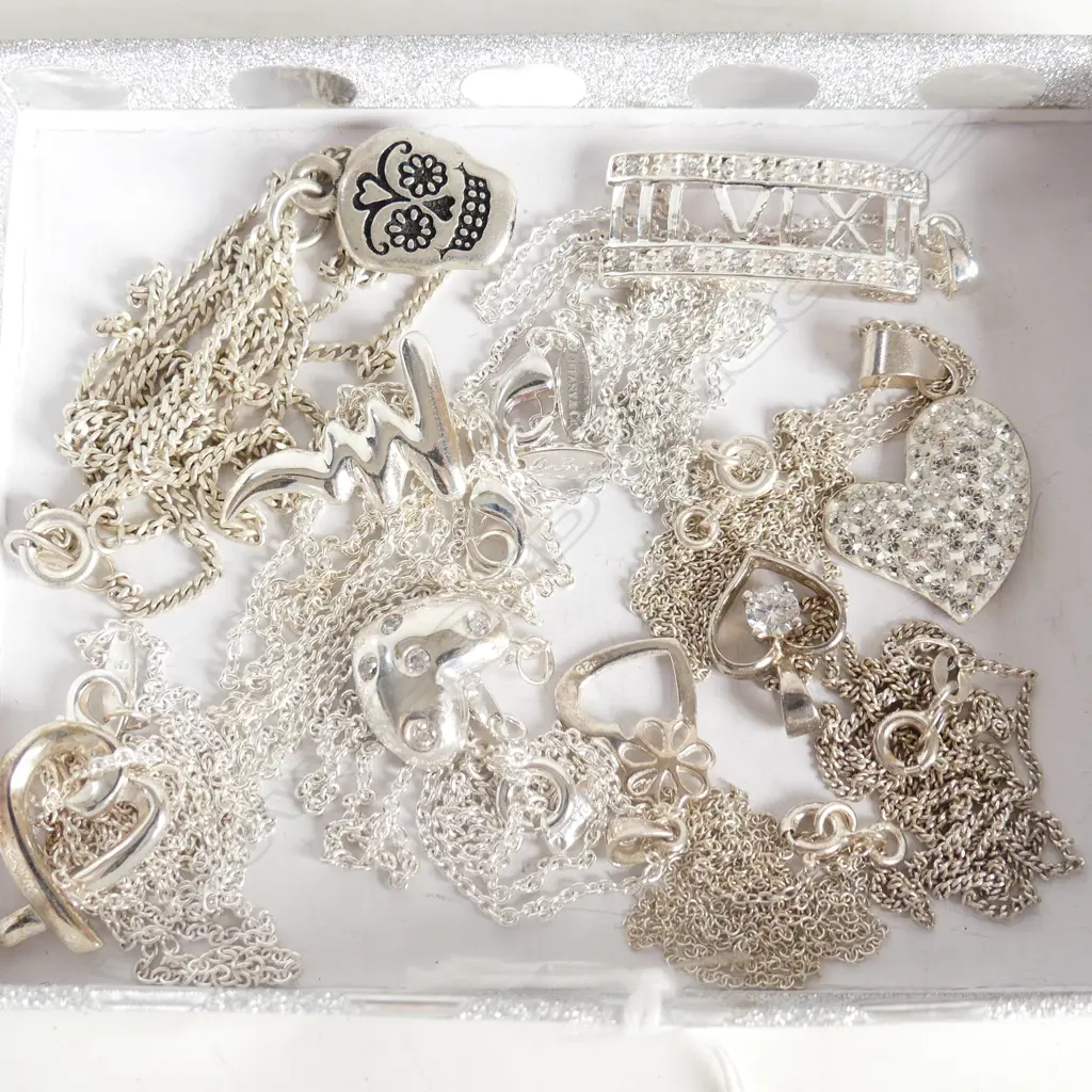 EIGHT ASSORTED SILVER PENDANTS &  CHAINS Image 1++