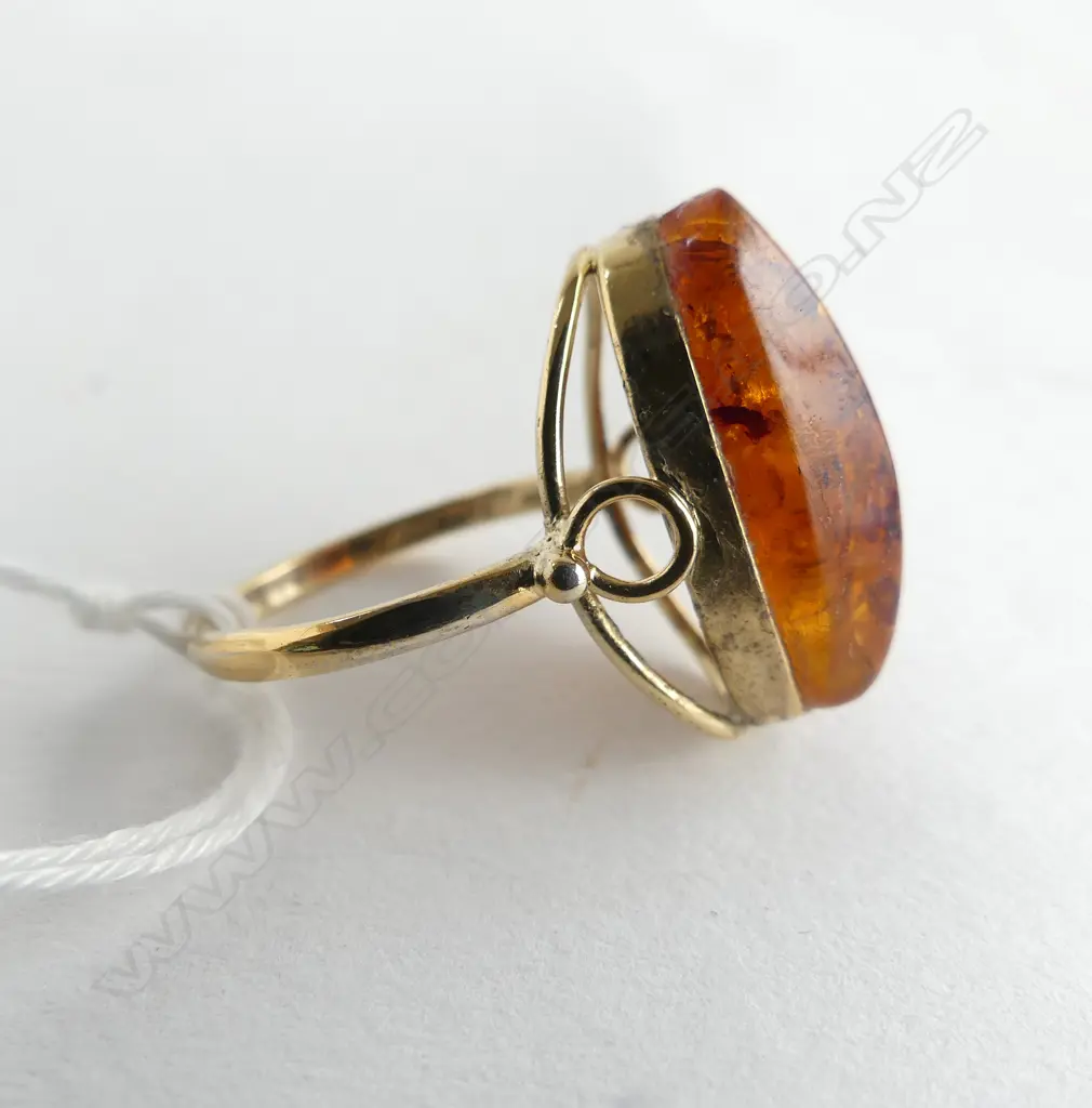 21CT AMBER RING 3.6gms SIZE P (GLUED INTO SETTING) Image 1++