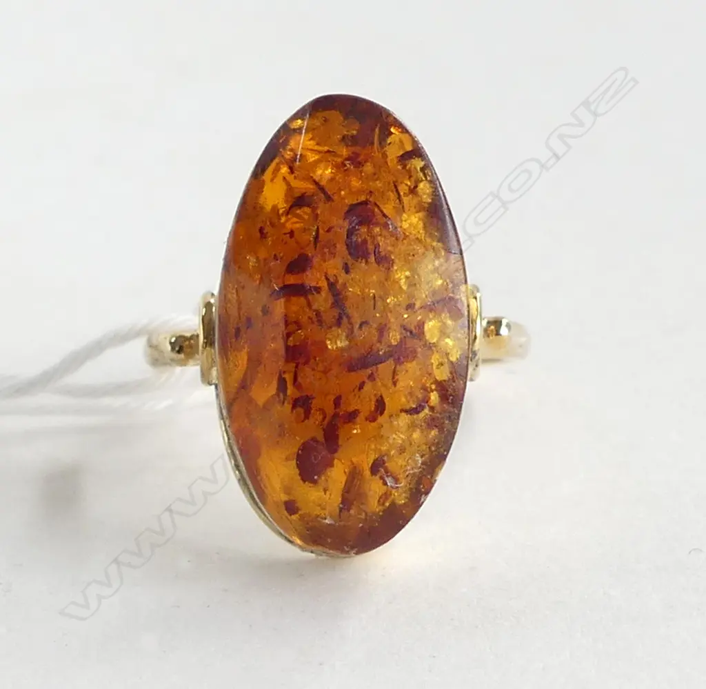 21CT AMBER RING 3.6gms SIZE P (GLUED INTO SETTING) Image 1++