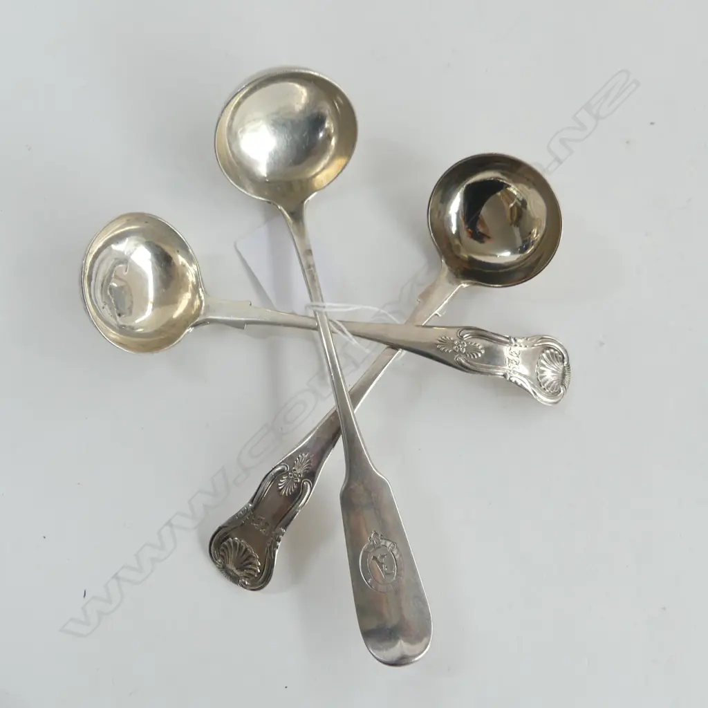 Three Scottish silver sauce ladles: a pair George IV, King's pattern single struck, Glasgow 1821; and a single Victorian Image 1++
