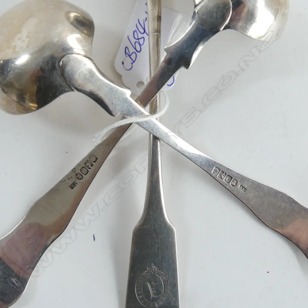 Three Scottish silver sauce ladles: a pair George IV, King's pattern single struck, Glasgow 1821; and a single Victorian Image 1++