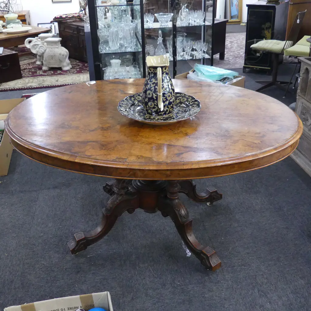 VICTORIAN FIGURED WALNUT OVAL LOO TABLE with cathedral carved & turned  base. 1420x1030x750mm Image 1++