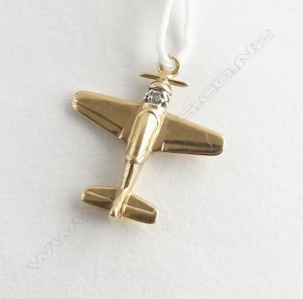 9ct yellow gold airplane (spitfire) SET WITH DIA. 1.6gms charm/pendant Image 1++