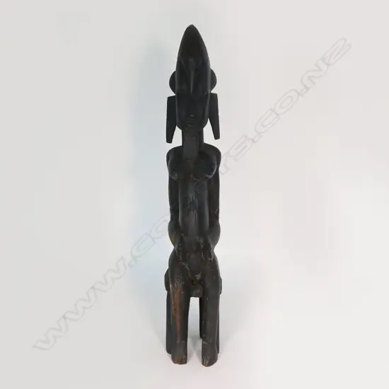 An African carved hardwood seated ancestral figure, H.680mm.