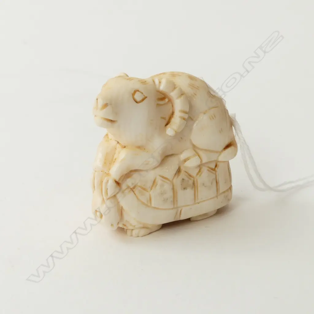 IVORY NETSUKE, GOAT SITTING ON A TORTOISE Image 1++