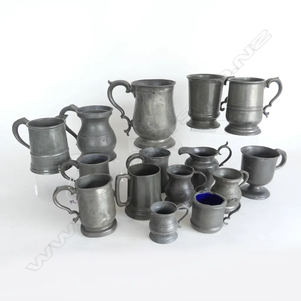Fifteen various pewter items including: James Yates baluster quart mug; Victorian pint mug with glass base; a pint mug with spout; other tankards, one jug etc., some items with damage. Image 1++