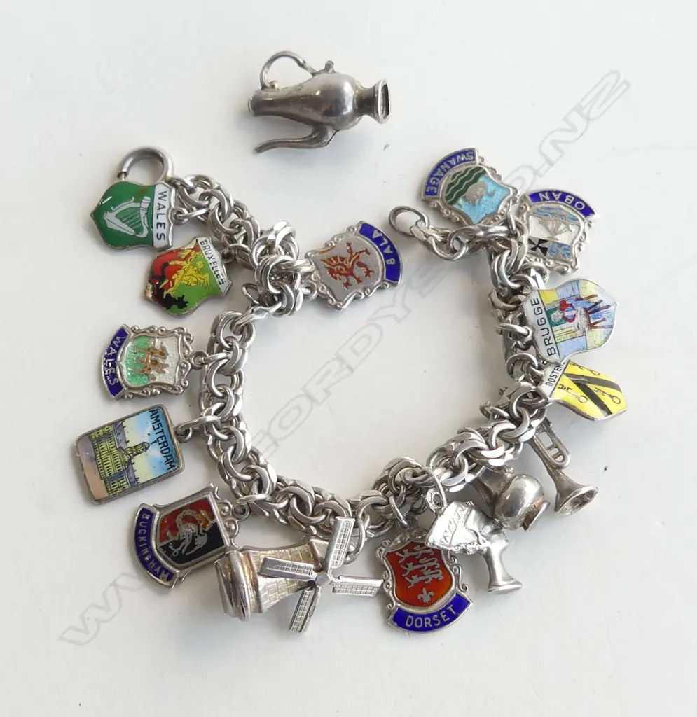 ASST. STG SILVER CHARMS, 34.5gms Image 1++