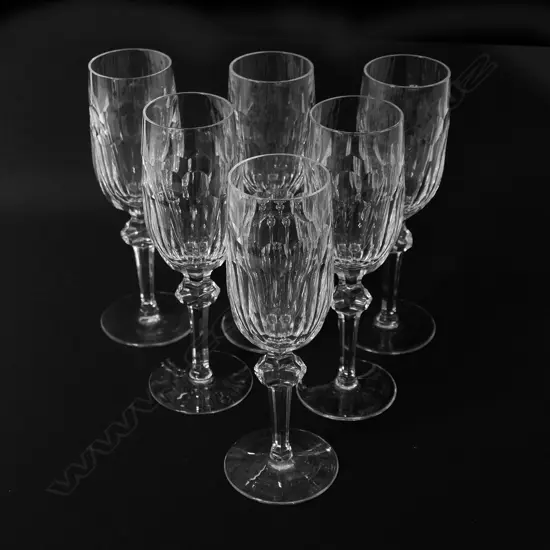 A set of six Waterford crystal champagne flutes,