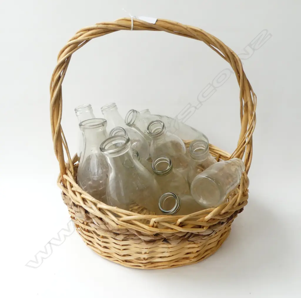 13 VINTAGE GLASS MILK BOTTLES VARIOUS SIZES IN CANE BASKET Image 1++
