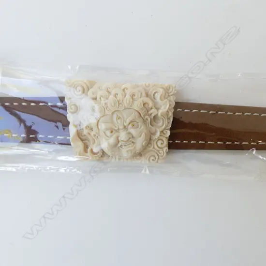 CARVED MAMMOTH TUSK IVORY PANELLED LEATHER BRACELET with certificate. In box