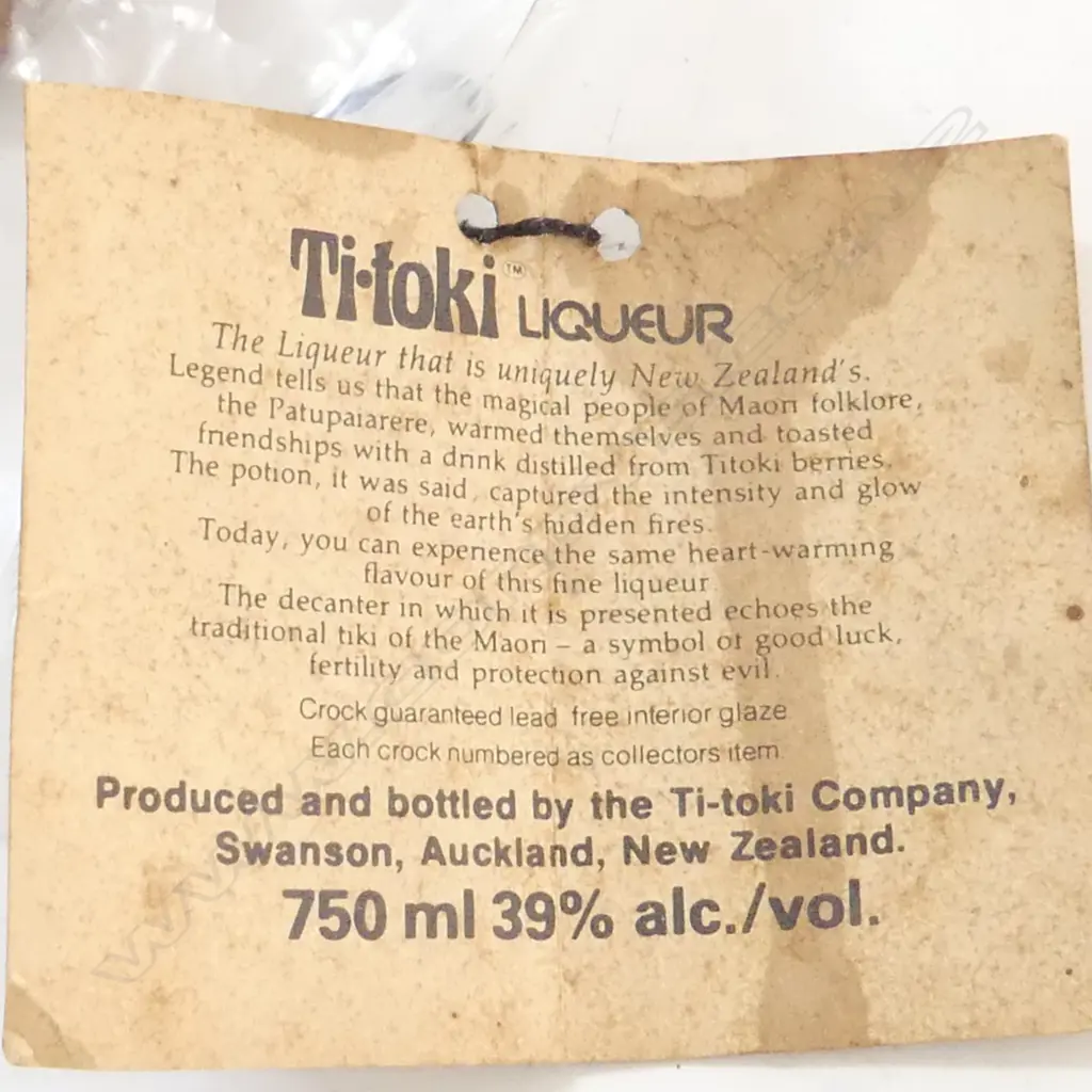 TI TOKI BOTTLE WITH ORIGINAL LABEL (TOP BROKEN OFF BUT PIECES IN A BAG) Image 1++