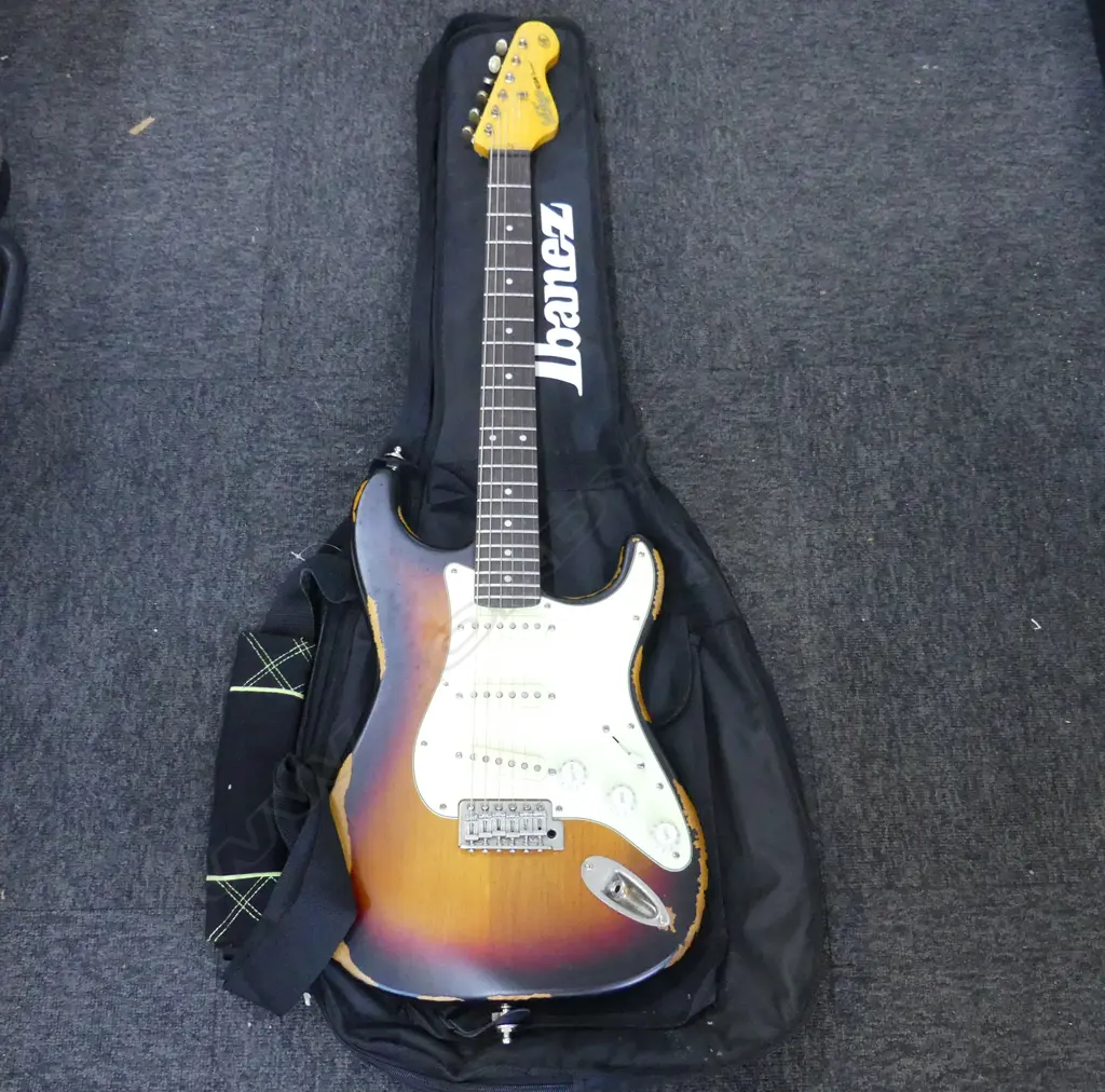 VINTAGE BRAND ICON SERIES V6 STRATOCASTER WITH SOFT CASE SHOWING WEAR Image 1++