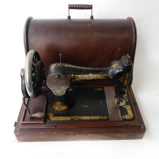 CASED SEWING MACHINE