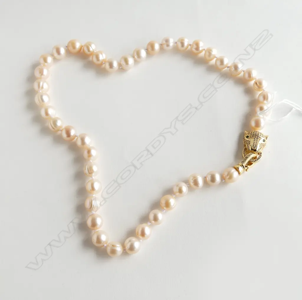 STRAND LARGE FRESH WATER CULTURED PEARL NECKLACE with gilt leopard head clasp set w white & green stones. L.400mm Image 1++