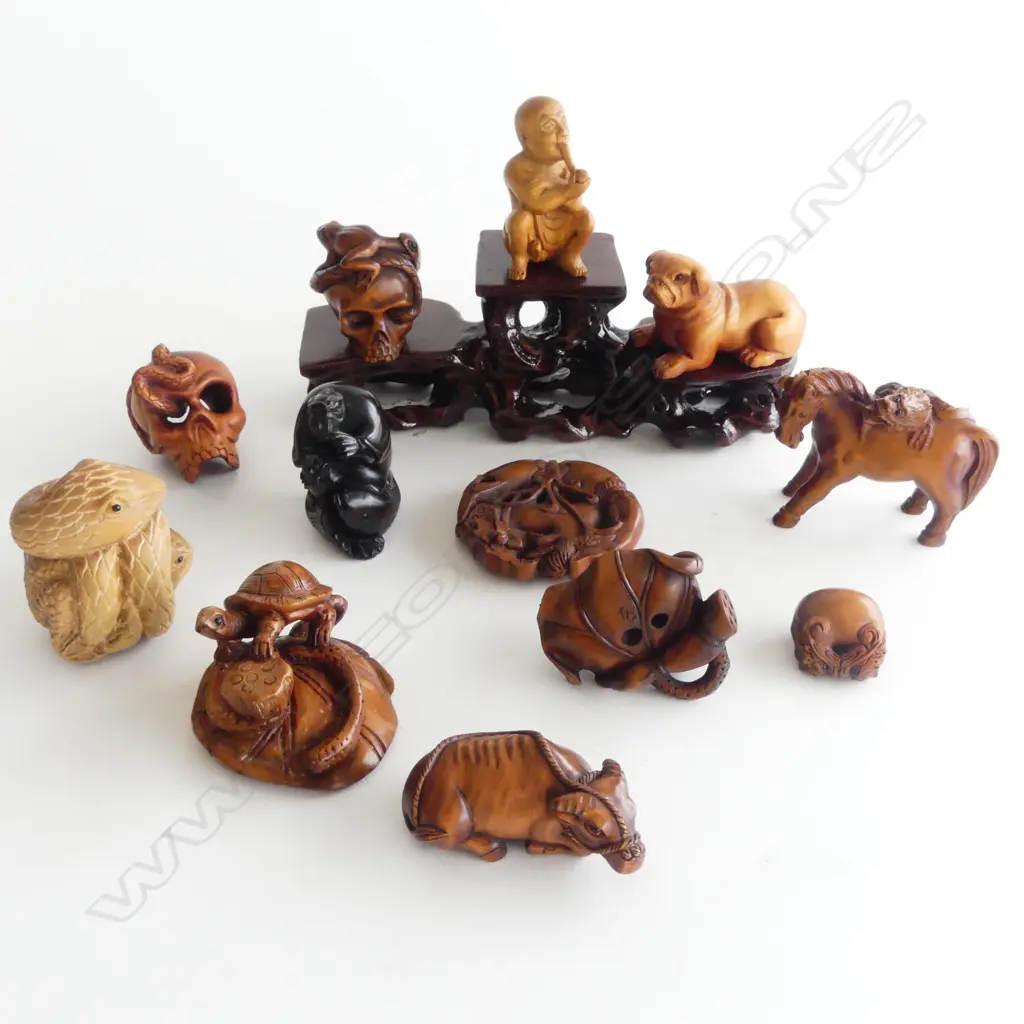 COLLECTION OF 12 WOOD NETSUKE & STAND Image 1++
