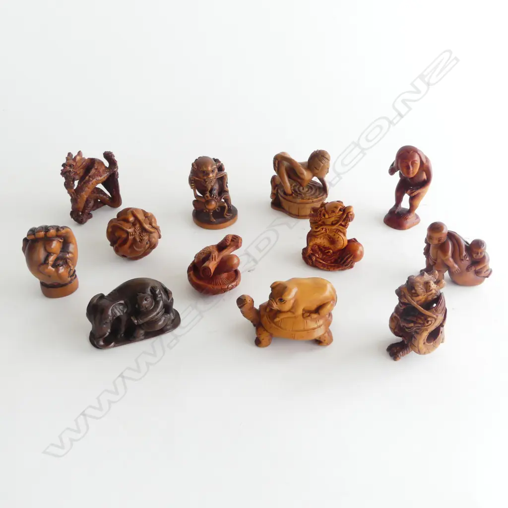 COLLECTION OF 12 WOOD NETSUKE Image 1++