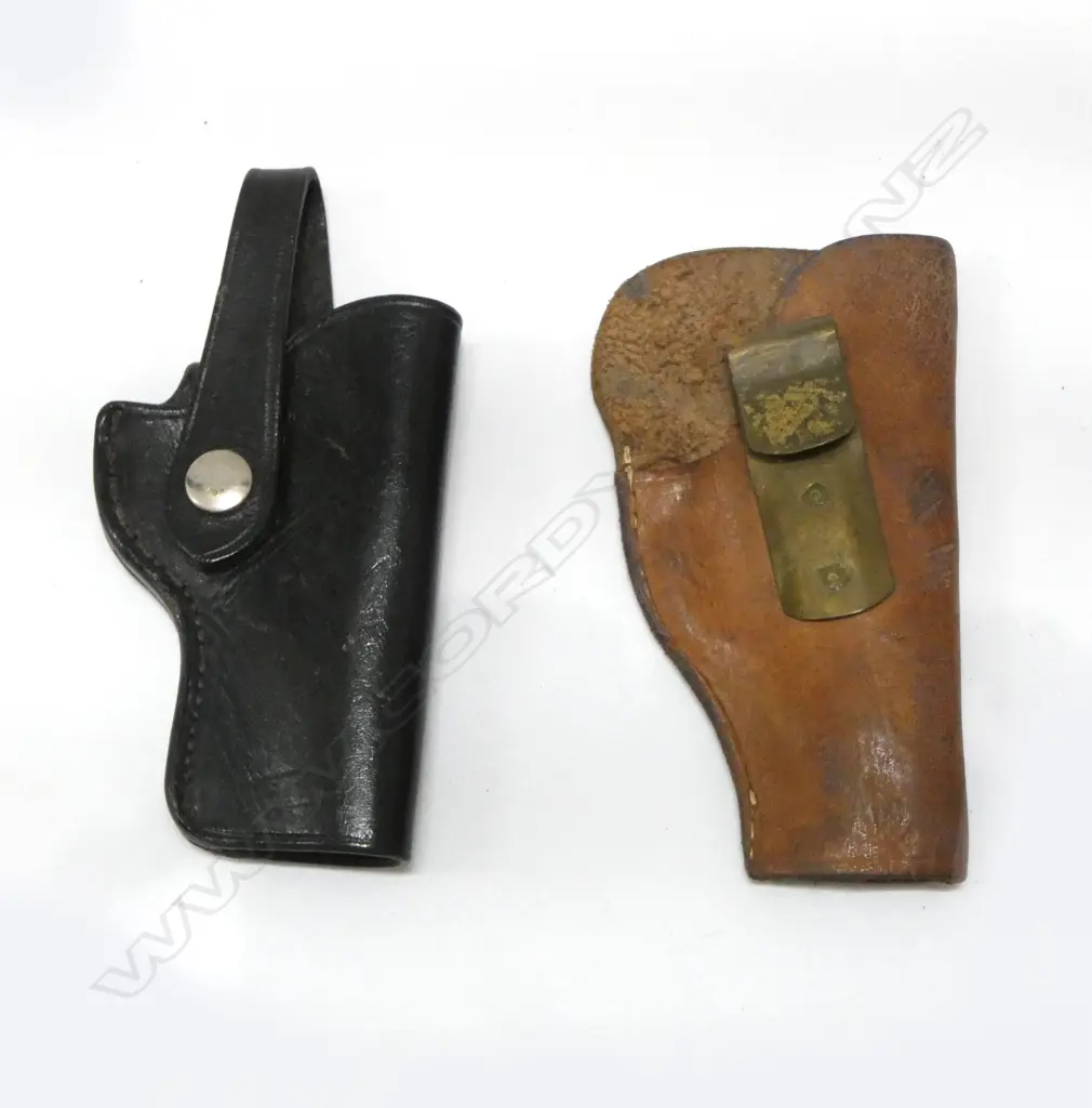 2 OLD LEATHER PISTOL HOLSTERS: 1 black with chrome dome. 1 brown with brass hook belt fitting Image 1++
