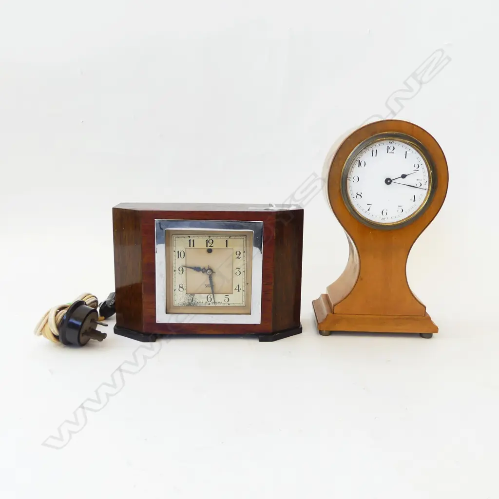 TWO  CLOCKS ONE EDWARDIAN WAISTED SHAPE BROKEN GLASS H.230mm &  SMITHS ELECTRIC WOODEN WITH CANTED CORNERS, L.200mm Image 1++