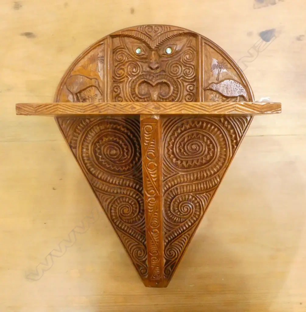 NZ RIMU CARVED WALL SHELF; Carved w. maori motif & central wheku w. inlaid paua eyes 280x165X370mm Image 1++