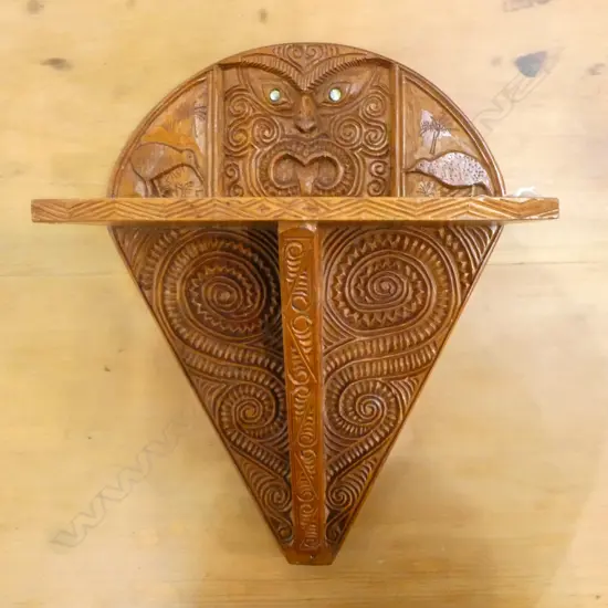 NZ RIMU CARVED WALL SHELF; Carved w. maori motif & central wheku w. inlaid paua eyes 280x165X370mm