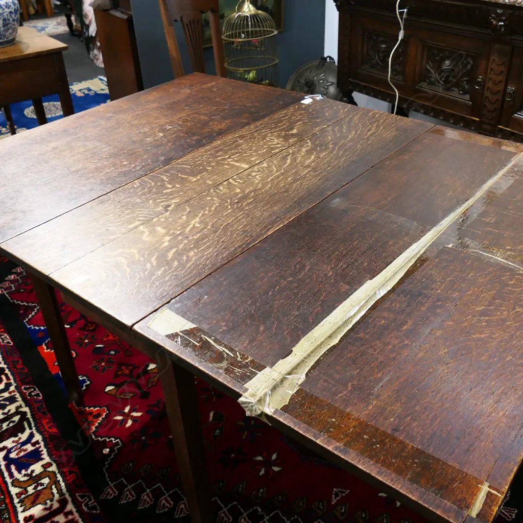 ANTIQUE OAK DROPSIDE DINING TABLE, 1460 x 1070 x 710mm, (taped split one leaf, marks to top) Image 1++