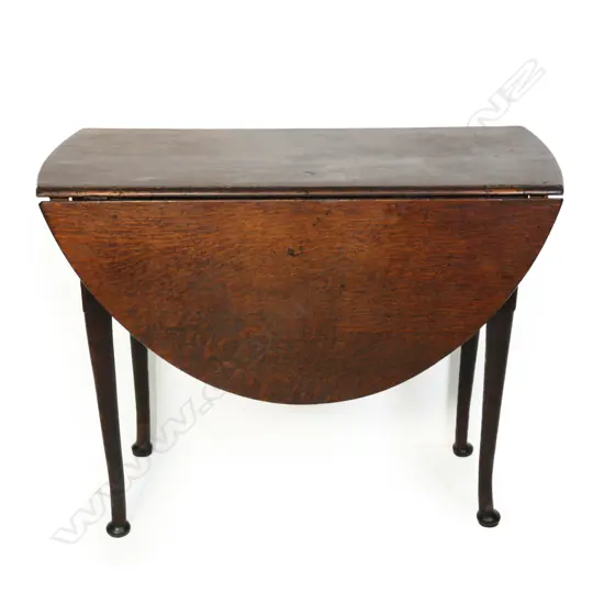 A George III oak drop leaf table,