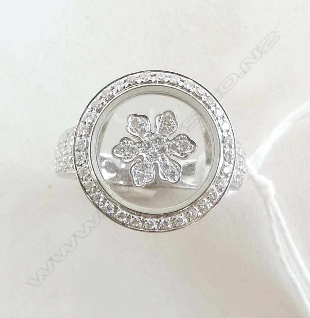 18CT WHITE GOLD & DIAMOND RING 83 diamonds TDW. 0.47ct. Retail $7200. floating center diamond cluster enclosed in glass Image 1++