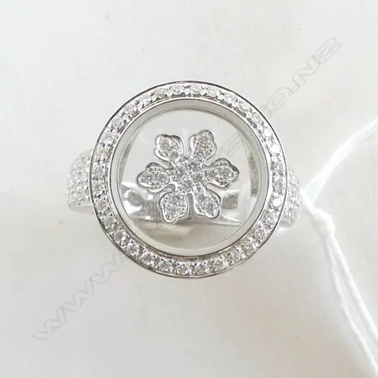 18CT WHITE GOLD & DIAMOND RING 83 diamonds TDW. 0.47ct. Retail $7200. floating center diamond cluster enclosed in glass