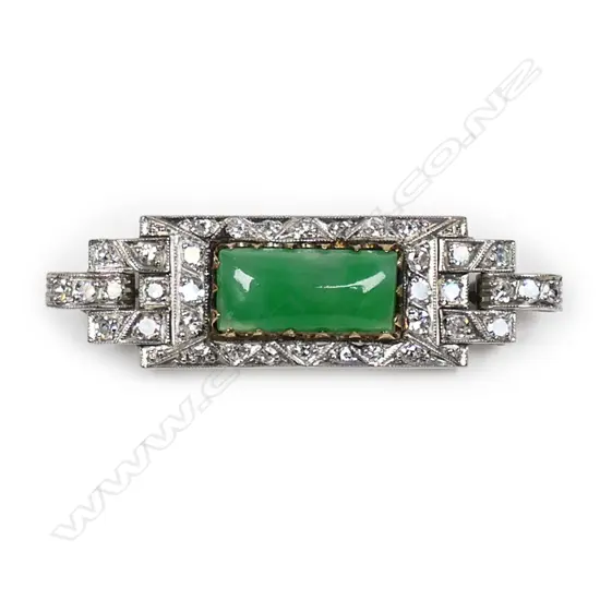 An 18ct. white gold, diamond and jade Art Deco brooch,