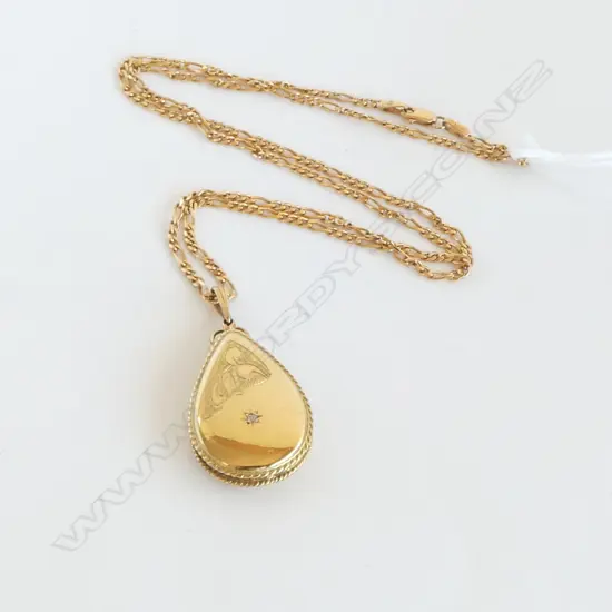 9CT GOLD LOCKET AND CHAIN  12.39gms