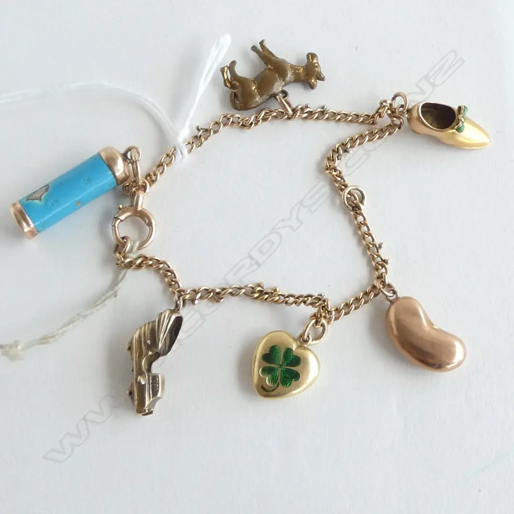 9ct GOLD CHARM BRACELET with 5 gold charms & 1 plated. 19gms Image 1++