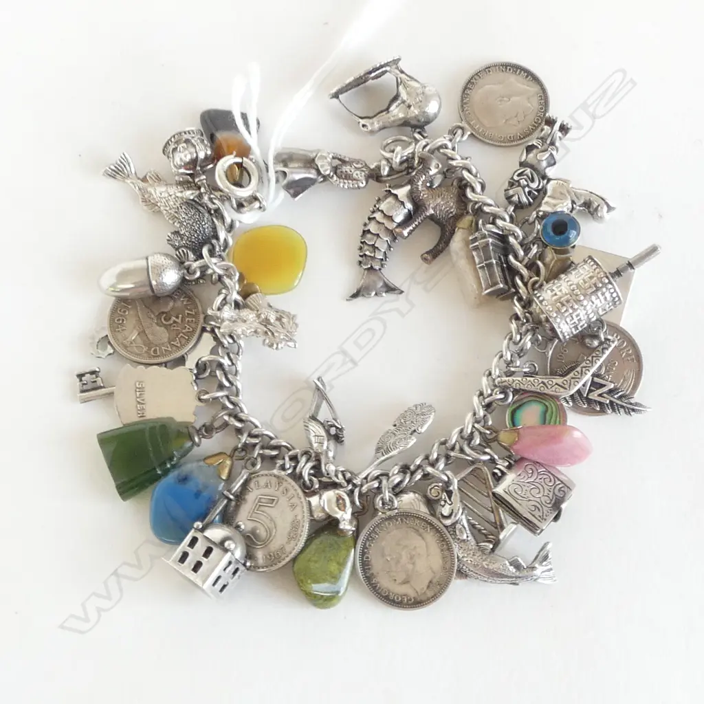 VINTAGE SILVER CHARM BRACELET loaded with charms mostly silver + paua + gem stones etc 70gms Image 1++
