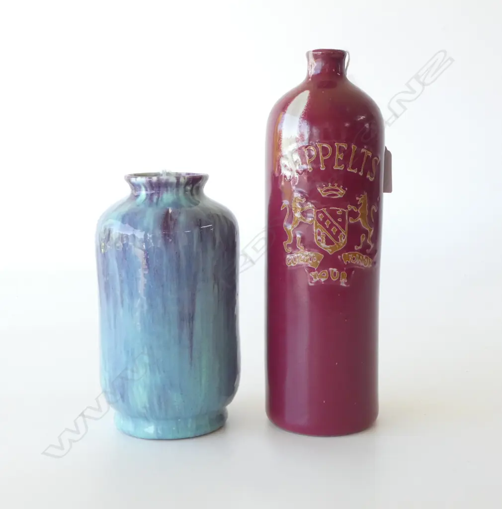 2 PCS CROWN LYNN; AMBRICO CYLINDER VASE, BLUE & PURPLE GLAZE, H.190mm (chip to foot) & SEPPELTS BURGUNDY BOTTLE H.270mm Image 1++