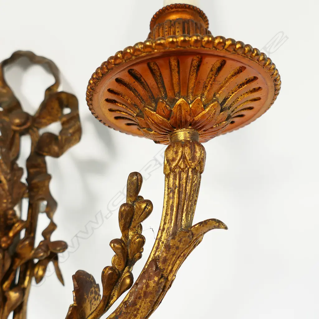 An early 20thC French gilded bronze wall sconce in the form of budding branches held together by a bow, two light branches. Requires rewiring. 330 x 570mm. Image 1++