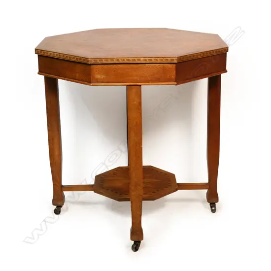 A William Norrie style inlaid games table,