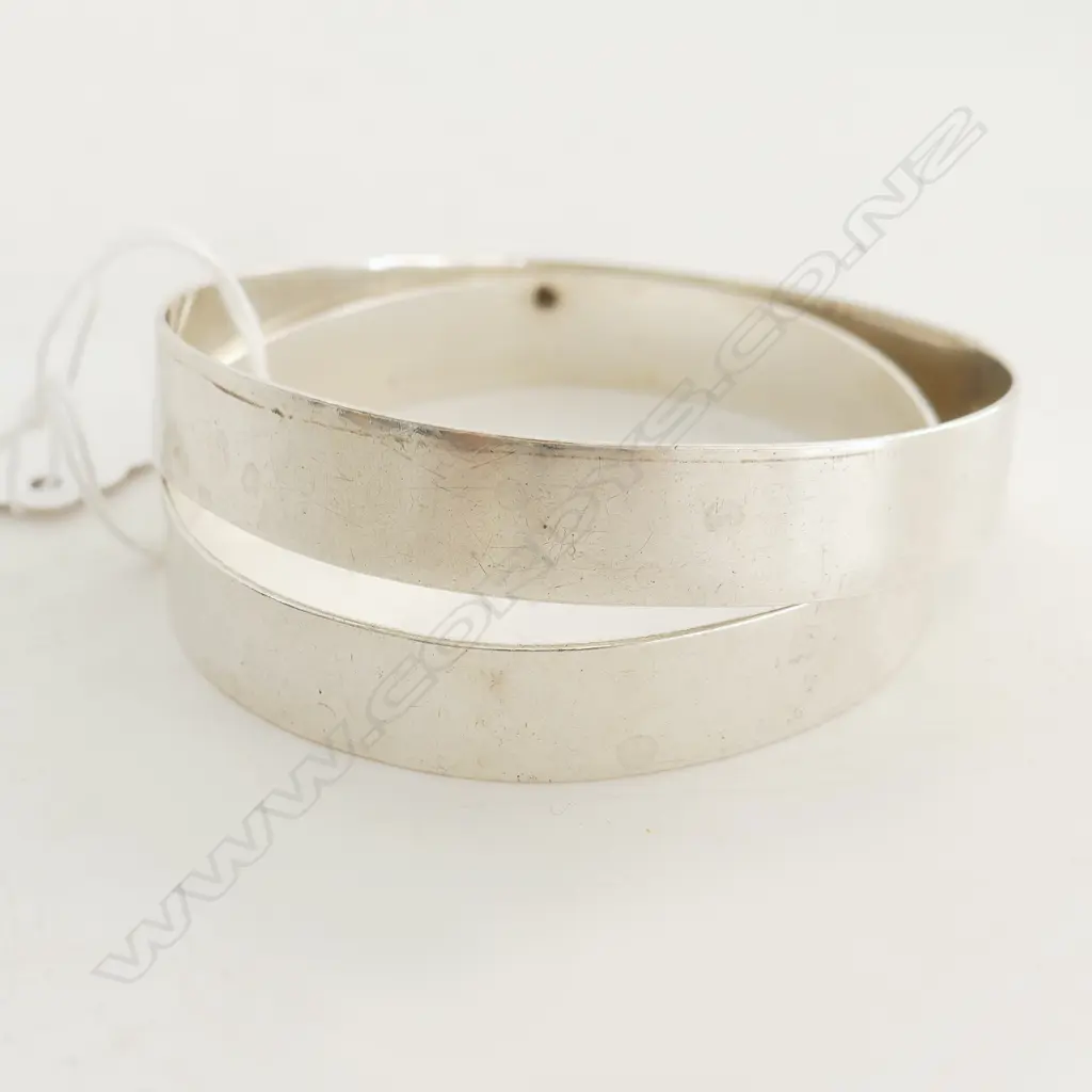 TWO SILVER BANGLES Image 1++