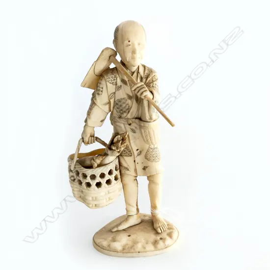 JAPANESE IVORY FIGURE; MAN WITH BASKET H.200mm