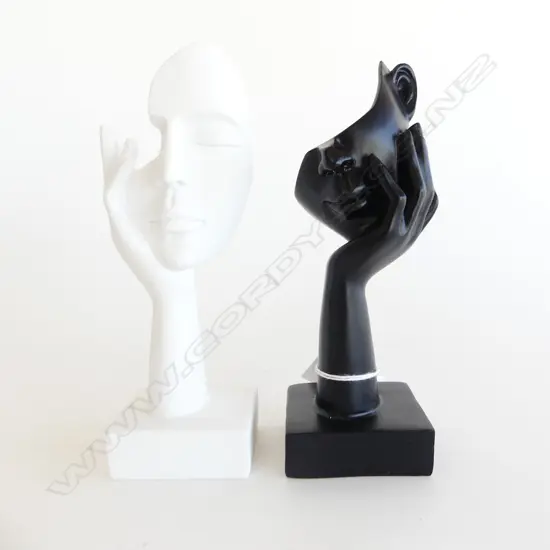BLACK & WHITE HEAD-IN-HAND STATUETTES. H.180mm