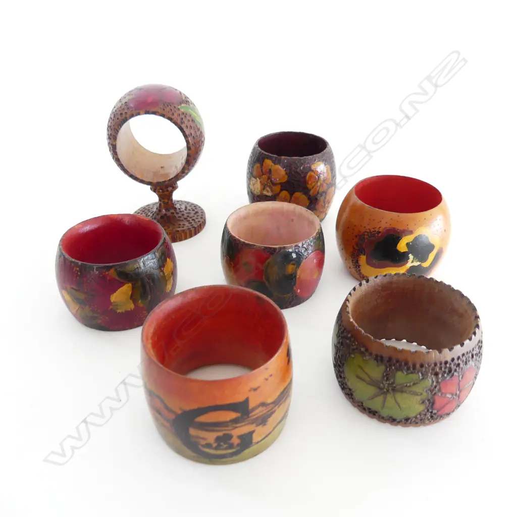 SEVEN NZ FOLK ART WOODEN NAPKIN RINGS – MAORI WHARE, POHUTUKAWA, PANSIES ETC  Image 1++