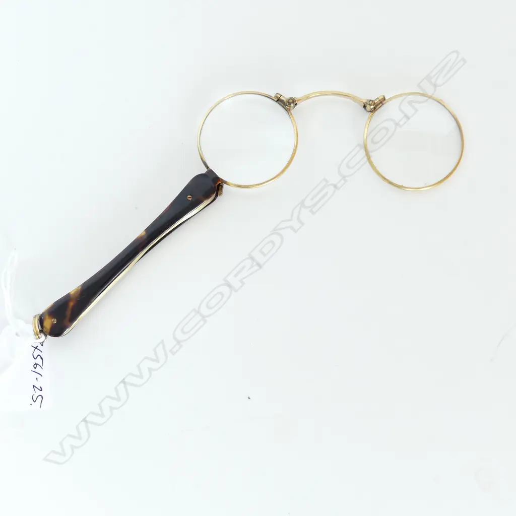 A pair of gold plated tortoiseshell handled lorgnettes Image 1++