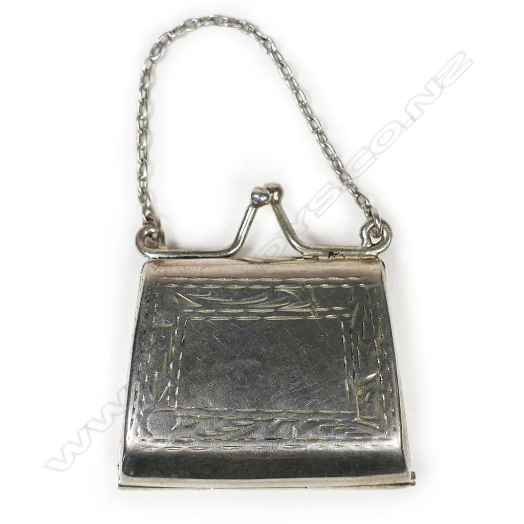 A silver stamp holder, Image 1++