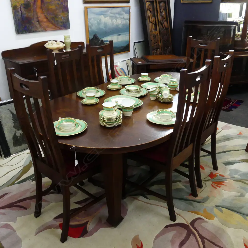 AN OAK DINING TABLE WITH THREE LEAVES AND SIX CHAIRS EX 1912 AUCKLAND EXHIBITION L EXTENDED 2000 MM Image 1++