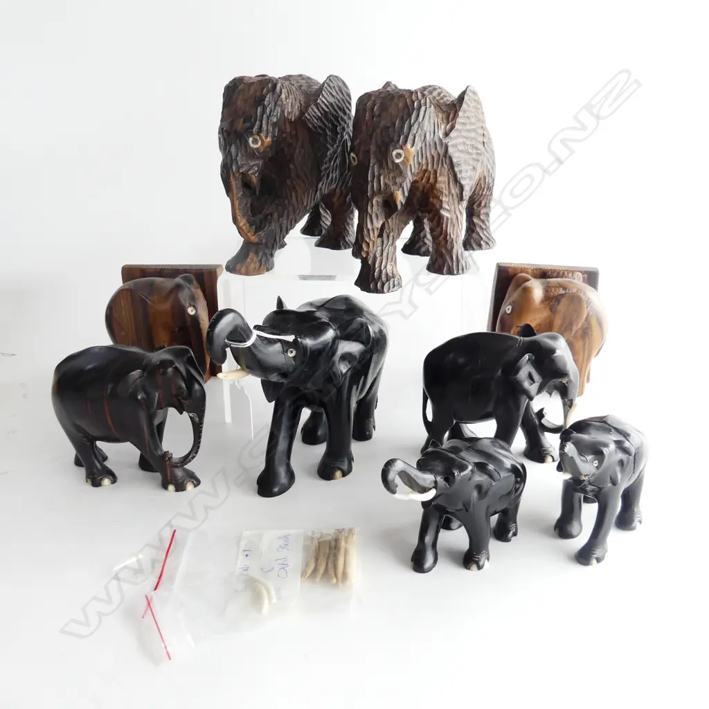 GROUP OF NINE CARVED ELEPHANTS. TWO CHIP CARVED H.140mm FIVE EBONY &TWO ZEBRAWOOD BOOKENDS Image 1++