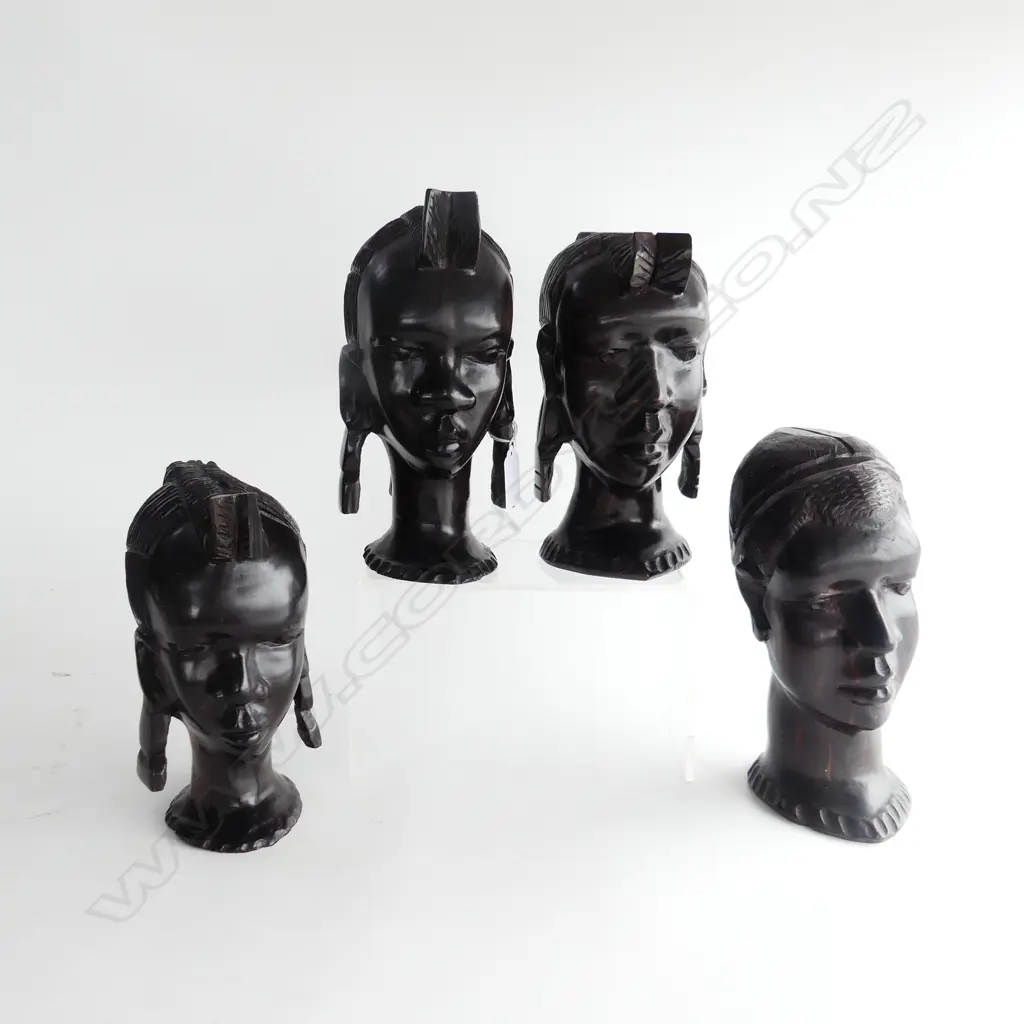 FOUR EBONY AFRICAN BUSTS. THREE FEMALE (WITH EARRINGS) ONE MALE. ALL H.200mm  Image 1++