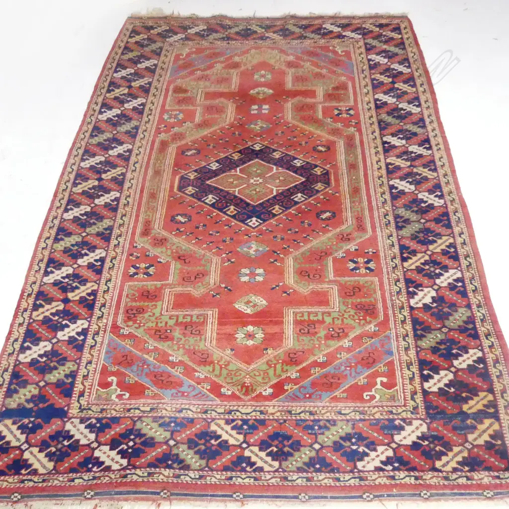 LARGE HANDKNOTTED WOOL PILE RUG. CENTRAL TERRACOTTA FIELD WITH CENTRAL MEDALLION AND BLUE TONES. 2500X1700mm Image 1++